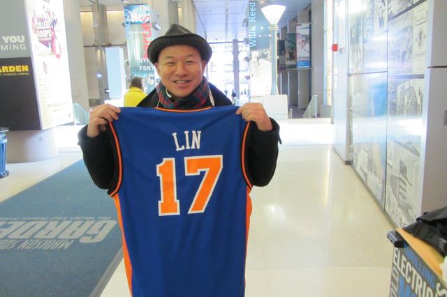 Chris Lee holding his new Jeremy Lin jersey  in Feburary